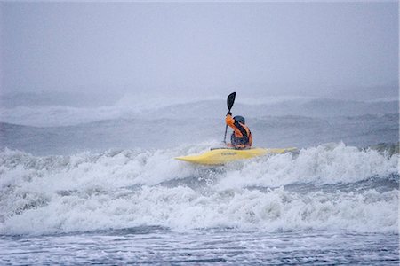 simsearch:400-04753113,k - Man kayak surfing in winter storm surf Kachemak Bay near Homer Kenai Peninsula Alaska Winter Stock Photo - Rights-Managed, Code: 854-02955111