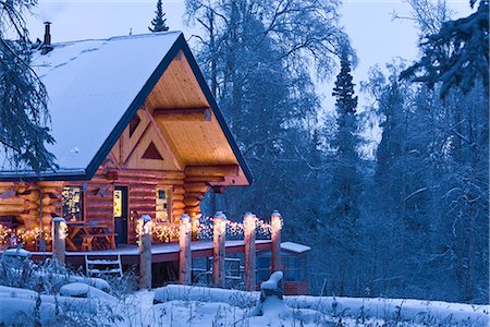 snowy night at home - Log Cabin in the woods decorated with Christmas lights at twilight near Fairbanks, Alaska during Winter Stock Photo - Rights-Managed, Code: 854-02955487