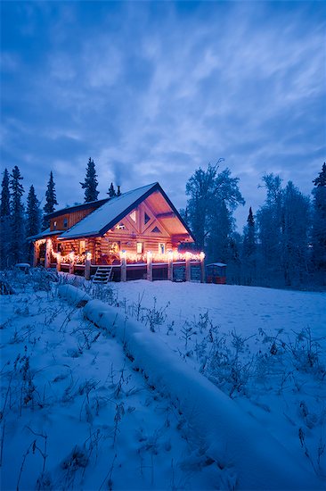 Log Cabin in the woods decorated with Christmas lights at twilight near Fairbanks, Alaska during Winter Stock Photo - Premium Rights-Managed, Artist: AlaskaStock, Image code: 854-02955488