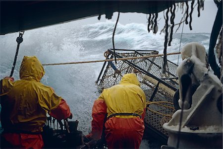 fishing boats usa - Fisherman Working on Deck in 50 Knot Winds Bering Sea AK /nOpilio Crab Season F/V Erla N Stock Photo - Rights-Managed, Code: 854-02955502