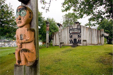 Totem poles & Tribal House of the Bear Chief Shakes Island Wrangell Alaska Southeast Summer Stock Photo - Rights-Managed, Code: 854-02955617