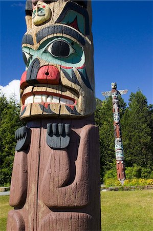 Mâts totémiques @ Saxman village près de Ketchikan en Alaska du sud-est été Tongass National Forest Photographie de stock - Rights-Managed, Code: 854-02955610