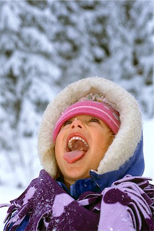 Young Girl Catching Snowflakes on Tongue SC AK Winter Stock Photo - Rights-Managed, Code: 854-02955751
