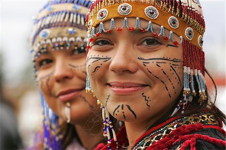 Native performers with traditional Alutiiq headdresses and facial tattoos at the Alaska State Fair in Palmer. Summer in Southcentral Alaska Stock Photo - Rights-Managed, Code: 854-02955773