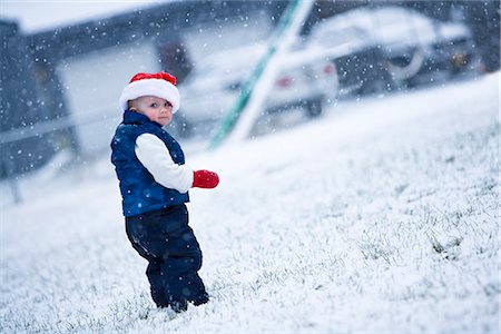 Portrait of girl infant wearing a Santa hat and walking in snow during Winter in Southcentral Alaska Stock Photo - Rights-Managed, Code: 854-02955866
