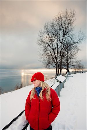 simsearch:854-03537981,k - Young woman talks on cell phone at the Baycrest pullout on the sterling highway near Homer, Alaska during Winter Stock Photo - Rights-Managed, Code: 854-02955933