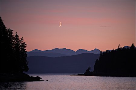 Moonrise at sunset looking out from Taku Harbor in the Inside Passage near Juneau, Alaska Stock Photo - Rights-Managed, Code: 854-02955945