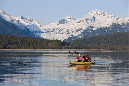 Kayakers paddle the calm waters of Alaska's Inside Passage with Herbert Glacier in the background, Tongass National Forest near Eagle Beach State Recreation Area. Stock Photo - Rights-Managed, Code: 854-03361806