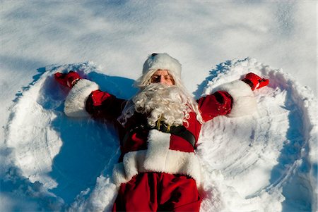 snow angel - Santa making a snow angel in fresh snow Stock Photo - Rights-Managed, Code: 854-03362345