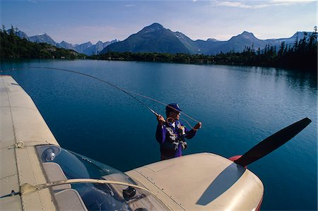 Flyfisherman casting from float on Cessna floatplane Antler Lake Southeast Foto de stock - Con derechos protegidos, Código: 854-03538011