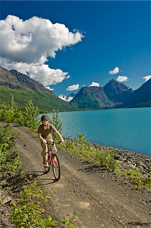 simsearch:854-03539096,k - Teenage boy riding his mountain bike on the Eklutna Lake bike trail during Summer in Southcentral Alaska Fotografie stock - Rights-Managed, Codice: 854-03538234