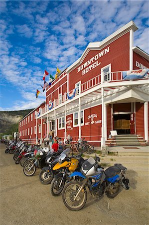 roads nwt - Motorcycles with the *Dust to Dawson* gathering parked in front of the Downtown Hotel in Dawson City, Canada Stock Photo - Rights-Managed, Code: 854-03538579