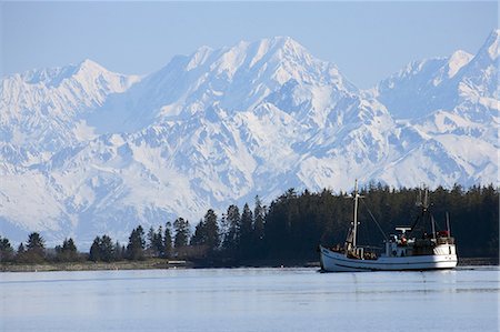 simsearch:854-03538698,k - Scenic view of the St. Elias Range with a fishing schooner in the foreground near Yakutat, Alaska Stock Photo - Rights-Managed, Code: 854-03538698