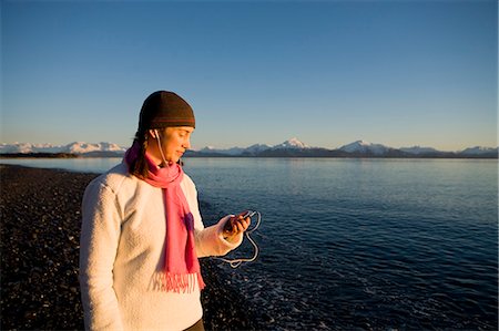 Woman listens to iPod at Bishops Beach at Kachemak Bay in Homer, Alaska Stock Photo - Rights-Managed, Code: 854-03538766
