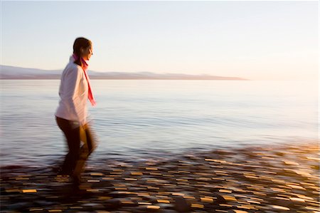 simsearch:400-03979334,k - Woman runs on Bishops Beach at Kachemak Bay in Homer, Alaska Stock Photo - Rights-Managed, Code: 854-03538769