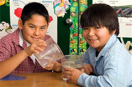 Alaskan native boys in classroom inside pouring water science Stock Photo - Rights-Managed, Code: 854-03538789