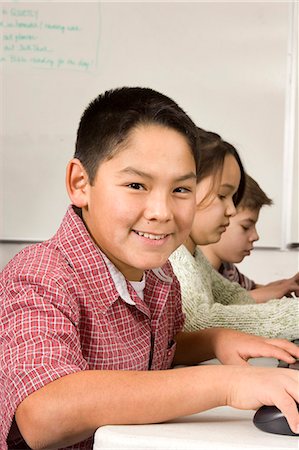 Alaskan native boy working at computer in classroom Alaska Inupiat Eskimo Foto de stock - Con derechos protegidos, Código: 854-03538813