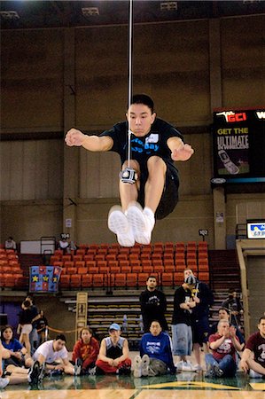 simsearch:854-03538945,k - Boy doing Two-Foot High Kick 2006 Senior Native Youth Olympic Games Alaska Anchorage Sullivan Arena Fotografie stock - Rights-Managed, Codice: 854-03538942