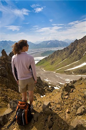 Woman standing on ridge overlooking the Root and Kennicott glaciers in Wrangell-St. Elias National Park, Alaska Fotografie stock - Rights-Managed, Codice: 854-03539131