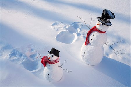 funny freezing cold photos - Snowmen in forest after making snow angel imprint in snow Alaska Winter Stock Photo - Rights-Managed, Code: 854-03539297