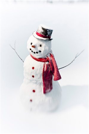 snowman scarf - Portrait of snowman with red scarf and black top hat, winter Stock Photo - Rights-Managed, Code: 854-03539304