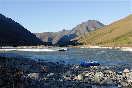 residue - Scenic view of a raft beached along the riverbank of Kongakut River with residual ice melting, ANWR, Arctic Alaska, Summer Stock Photo - Rights-Managed, Code: 854-03645863