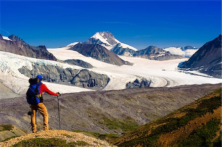 enjoy mountain view - Male backpacker stops to view Gulkana Glacier while hiking in the Alaska Range, Southcentral Alaska, Summer/n Stock Photo - Rights-Managed, Code: 854-03645935