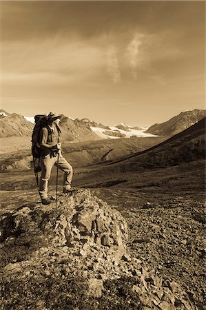 simsearch:854-02954903,k - Male backpacker stops to view Gulkana Glacier while hiking in the Alaska Range, Southcentral Alaska, Summer/n Stock Photo - Rights-Managed, Code: 854-03645930