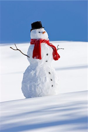 Snowman with a red scarf and black top hat sitting next to a snow covered river bed, Southcentral Alaska, Winter Stock Photo - Rights-Managed, Code: 854-03646486