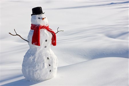 snow christmas nobody - Snowman with a red scarf and black top hat sitting next to a snow covered river bed, Southcentral Alaska, Winter Stock Photo - Rights-Managed, Code: 854-03646494