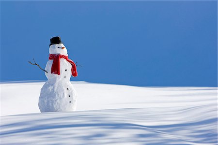 simsearch:854-03646488,k - Snowman with a red scarf and black top hat sitting next to a snow covered river bed, Southcentral Alaska, Winter Stock Photo - Rights-Managed, Code: 854-03646491