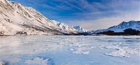 simsearch:854-02956172,k - View of sastrugi wind carved ridges in the snow covering frozen Phelan Creek alongside the Richardson Highway as it heads into the Alaska Range, Southcentral Alaska, Winter Stock Photo - Rights-Managed, Code: 854-03646708