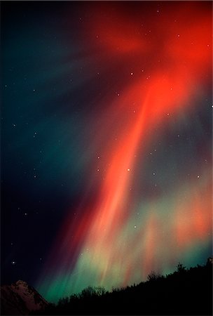 Red Northern Lights (Aurora Borealis) fill the night sky in Chugach State Park, Anchorage, Southcentral Alaska, Winter Stock Photo - Rights-Managed, Code: 854-03646787