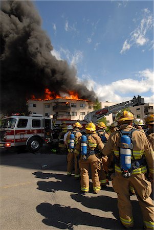 simsearch:854-05974224,k - Anchorage Fire Department fire fighters from Station Five respond to a massive fire in the North Building of the Park Place Condominiums in Downtown Anchorage, Southcentral Alaska, Summer Stock Photo - Rights-Managed, Code: 854-03646804