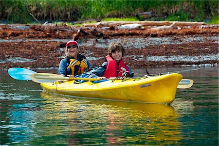 pictures of family fishing boats - Mother and son sea kayaking and fishing in Prince William Sound, Culross Passage, Southcentral Alaska, Summer Stock Photo - Rights-Managed, Code: 854-03739568