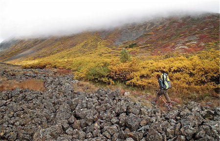 simsearch:854-05974386,k - Female backpacker hiking to the 3,200 ft pass leading to the headwaters of Santucary River, Denali National Park, Interior Alaska, Autumn Stock Photo - Rights-Managed, Code: 854-03739574