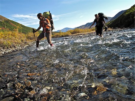 simsearch:854-02955228,k - Two female hikers with walking sticks crosses Windy Creek along the Sanctuary River Trail in Denali National Park, Interior Alaska, Autumn Stock Photo - Rights-Managed, Code: 854-03739573