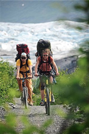 Two people bicycling on the trail to Spencer Glacier, Chugach National Forest, Kenai Peninsula, Southcentral Alaska, Summer Stock Photo - Rights-Managed, Code: 854-03739615