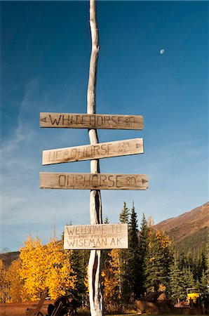 sign arrow direction not vector not risk not street not people - View of a humorous signpost in Wiseman, Arctic Alaska, Fall Stock Photo - Rights-Managed, Code: 854-03739655