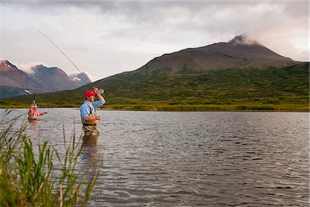 fishing lodge - Anglers fly fishing in Bristol Bay in the evening near Crystal Creek Lodge, King Salmon, Southwest Alaska, Summer Stock Photo - Rights-Managed, Code: 854-03739724