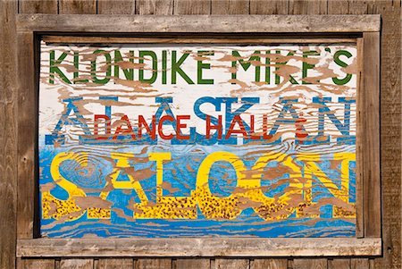 Close up of a sign for Klondike Mike's Alaskan Saloon, Palmer, Southcentral Alaska, Summer. Digitally altered Stock Photo - Rights-Managed, Code: 854-03739898