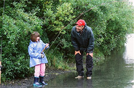 salmon pink - Grandfather encourages grandaughter as she battles a Pink salmon in Ingram Creek off the Seward Highway, Southcentral Alaska, Summer Stock Photo - Rights-Managed, Code: 854-03740165