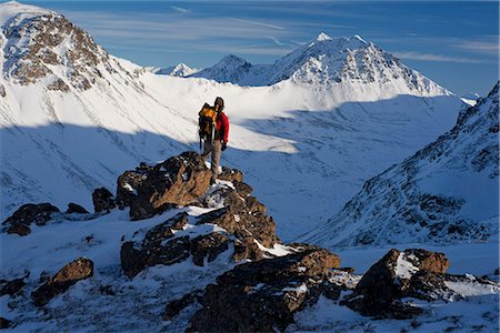 A winter hiker looks down over Powerline Pass with Avalanche Peak in the Background, Chugach State Park, Southcentral Alaska, Winter Stock Photo - Rights-Managed, Code: 854-03740275