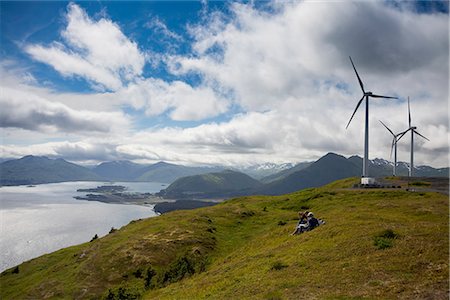 Hikers enjoying a sunny afternoon walk near the wind turbines, part of the Pillar Mountain Wind Project, operated and owned by the Kodiak Electric Association, Pillar Mountain, Kodiak Island, Southwest Alaska, Summer Stock Photo - Rights-Managed, Code: 854-03845225