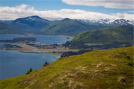 Hikers enjoying a sunny afternoon hiking towards the wind turbines overlooking St. Paul Harbor, Pillar Mountain Wind Project, operated and owned by the Kodiak Electric Association, Pillar Mountain, Kodiak Island, Southwest Alaska, Summer Stock Photo - Rights-Managed, Code: 854-03845261