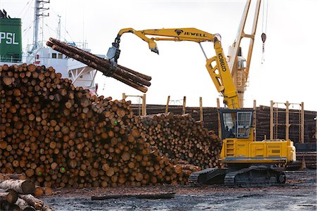 farm harvesting equipment - View of log ship being loaded with Sitka Spruce from Chiniak and Sequel Point at LASH dock in Women's Bay, Kodiak Island, Southwest Alaska, Autumn Stock Photo - Rights-Managed, Code: 854-03845274