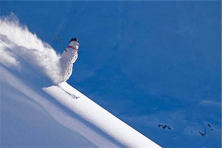 Snowman skiing down ridgeline in Talkeetna Mountains, Southcentral Alaska, Winter. Composite Stock Photo - Rights-Managed, Code: 854-03846140