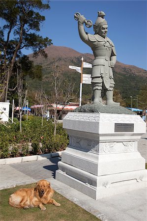 simsearch:855-05984035,k - A statue displayed on the Approach to Po Lin Monastery with a dog lying beside, Lantau Island, Hong Kong Foto de stock - Con derechos protegidos, Código: 855-05984036