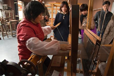 simsearch:855-05984122,k - Weaving demonstration at a silkworm factory, Shunde, Guangdong, China Stock Photo - Rights-Managed, Code: 855-05984116