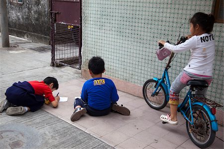Children playing at the alley of their home at Kam Tin, New Territories, Hong Kong Stock Photo - Rights-Managed, Code: 855-05984185